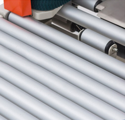 Carton transport rollers