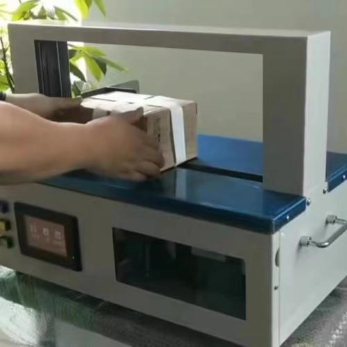 Adjustable Tension 5–50N Automatic Paper Banding Machine for Cake Box, Book & Card Packaging | Gentle No-Crush OPP Film Bundler with Kraft Paper Tape Support